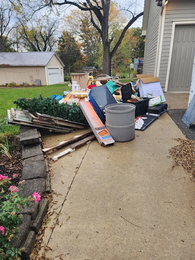 Dumpster being loaded with debris for 30 Yard Dumpster Rental in Beulah